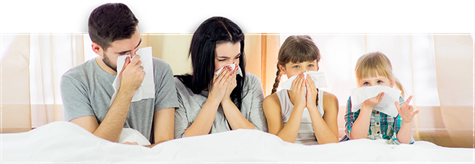 image of a family sneezing